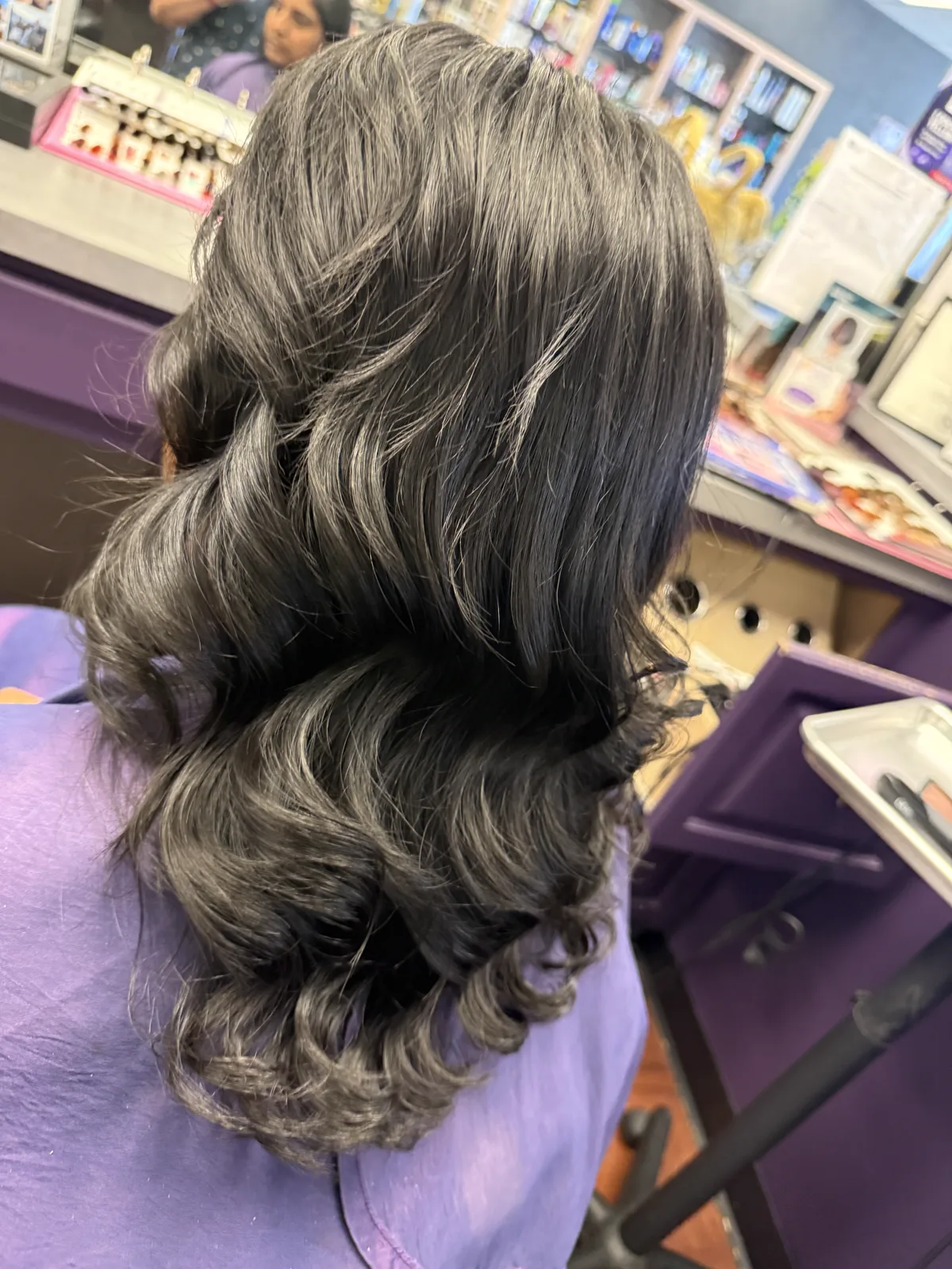 Glossy curled hairstyle finished at Cute Cuts in Smyrna, Tennessee